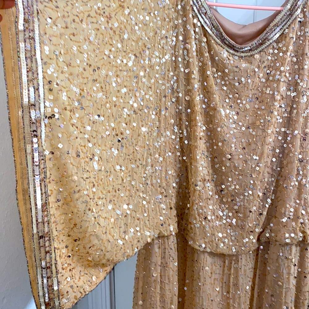 This sequence dress is perfect for the festive holiday season. Size 14.